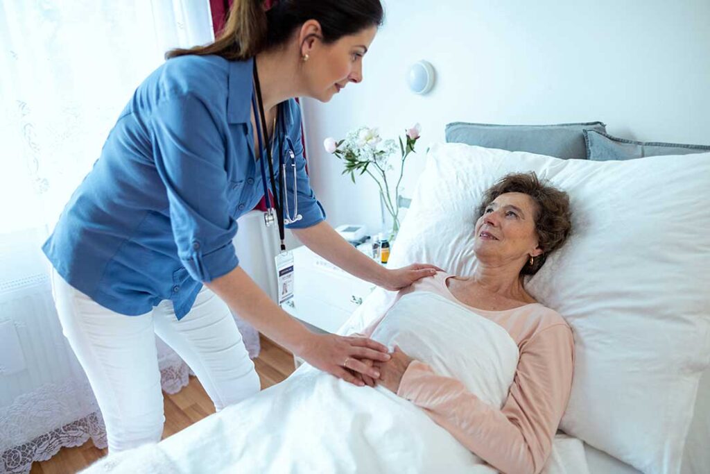 Older adult and caregiver reviewing a daily care plan at a bright assisted living residence.