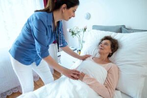 Older adult and caregiver reviewing a daily care plan at a bright assisted living residence.